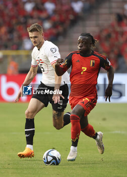 2023-06-17 - Jeremy Doku of Belgium, left Stefan Posch of Austria during the UEFA Euro 2024, European Qualifiers, Group F, football match between Belgium and Austria on June 17, 2023 at King Baudouin Stadium in Brussels, Belgique - FOOTBALL - EURO 2024 - QUALIFYING - BELGIUM V AUSTRIA - UEFA EUROPEAN - SOCCER