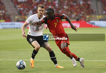 2023-06-17 - Jeremy Doku of Belgium, left Stefan Posch of Austria during the UEFA Euro 2024, European Qualifiers, Group F, football match between Belgium and Austria on June 17, 2023 at King Baudouin Stadium in Brussels, Belgique - FOOTBALL - EURO 2024 - QUALIFYING - BELGIUM V AUSTRIA - UEFA EUROPEAN - SOCCER