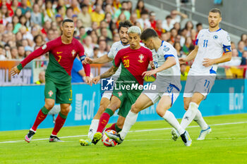 2023-06-17 - Joao Cancelo of Portugal and Gojko Cimirot of Bosnia and Herzegovina during the UEFA Euro 2024, European Qualifiers, Group J, football match between Portugal and Bosnia and Herzegovina on June 17, 2023 at Estádio do SL Benfica in Lisbon, Portugal - FOOTBALL - EURO 2024 - QUALIFYING - PORTUGAL V BOSNIA HERZEGOVINA - UEFA EUROPEAN - SOCCER