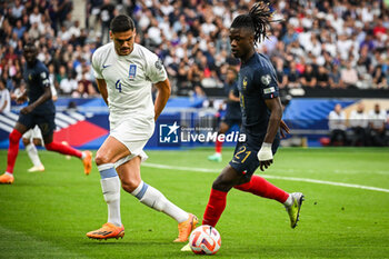 2023-06-19 - Konstantinos MAVROPANOS of Greece and Eduardo CAMAVINGA of France during the UEFA Euro 2024, European Qualifiers, Group B, football match between France and Greece on June 19, 2023 at Stade de France in Saint-Denis, France - FOOTBALL - EURO 2024 - QUALIFYING - FRANCE V GREECE - UEFA EUROPEAN - SOCCER