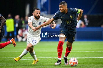2023-06-19 - Manolis SIOPIS of Greece and Kylian MBAPPE of France during the UEFA Euro 2024, European Qualifiers, Group B, football match between France and Greece on June 19, 2023 at Stade de France in Saint-Denis, France - FOOTBALL - EURO 2024 - QUALIFYING - FRANCE V GREECE - UEFA EUROPEAN - SOCCER