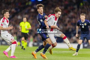 2023-06-20 - Luka Gagnidze of Georgia and Aaron Hickey of Scotland during the UEFA Euro 2024, European Qualifiers, Group A football match between Scotland and Georgia on 20 June 2023 at Hampden Park in Glasgow, Scotland - FOOTBALL - EURO 2024 - QUALIFYING - SCOTLAND V GEORGIA - UEFA EUROPEAN - SOCCER