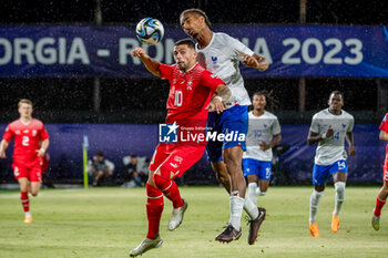 2023-06-28 - Swiss U21’s Kastriot Imeri in action against France U21’s Loic Bade during the third qualifying round UEFA European Under-21 Championship 2023 soccer match Switzerland U21 vs. France U21 at the CFR Cluj Stadium in Cluj Napoca, Romania, 28nd of June 2023 - UNDER 21 MEN - SWITZERLAND VS FRANCE - UEFA EUROPEAN - SOCCER