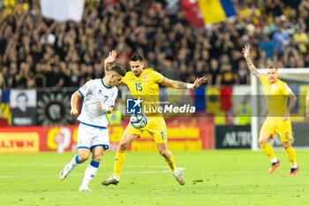 2023-09-12 - Andrei Burca of Romania and Milot Rashica of Kosovo during the UEFA Euro 2024, European Qualifiers, Group I football match between Romania and Kosovo on September 12, 2023 at Arena Nationala in Bucharest, Romania - FOOTBALL - EURO 2024 - QUALIFYING - ROMANIA V KOSOVO - UEFA EUROPEAN - SOCCER