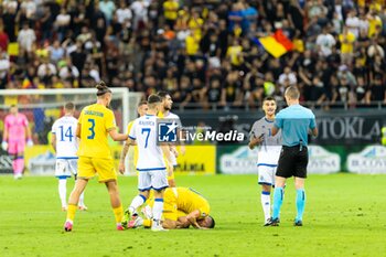 2023-09-12 - Nicolae Stanciu of Romania suffering from a tackle during the UEFA Euro 2024, European Qualifiers, Group I football match between Romania and Kosovo on September 12, 2023 at Arena Nationala in Bucharest, Romania - FOOTBALL - EURO 2024 - QUALIFYING - ROMANIA V KOSOVO - UEFA EUROPEAN - SOCCER