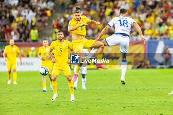 2023-09-12 - Radu Dragusin of Romania and Vedat Muriqi of Kosovo during the UEFA Euro 2024, European Qualifiers, Group I football match between Romania and Kosovo on September 12, 2023 at Arena Nationala in Bucharest, Romania - FOOTBALL - EURO 2024 - QUALIFYING - ROMANIA V KOSOVO - UEFA EUROPEAN - SOCCER