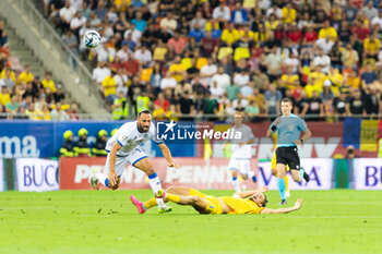 2023-09-12 - Vedat Muriqi of Kosovo and Radu Dragusin of Romania during the UEFA Euro 2024, European Qualifiers, Group I football match between Romania and Kosovo on September 12, 2023 at Arena Nationala in Bucharest, Romania - FOOTBALL - EURO 2024 - QUALIFYING - ROMANIA V KOSOVO - UEFA EUROPEAN - SOCCER