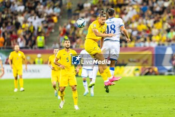 2023-09-12 - Radu Dragusin of Romania and Vedat Muriqi of Kosovo during the UEFA Euro 2024, European Qualifiers, Group I football match between Romania and Kosovo on September 12, 2023 at Arena Nationala in Bucharest, Romania - FOOTBALL - EURO 2024 - QUALIFYING - ROMANIA V KOSOVO - UEFA EUROPEAN - SOCCER