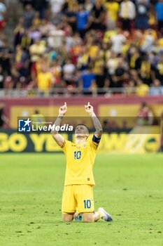 2023-09-13 - Nicolae Stanciu of Romania celebrates scoring his team's first goal to make the score during the UEFA Euro 2024, European Qualifiers, Group I football match between Romania and Kosovo on September 12, 2023 at Arena Nationala in Bucharest, Romania - FOOTBALL - EURO 2024 - QUALIFYING - ROMANIA V KOSOVO - UEFA EUROPEAN - SOCCER