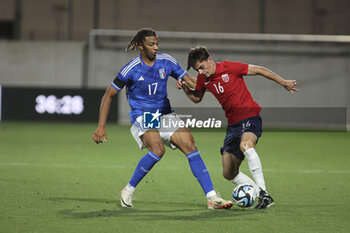 2023-10-17 - Magnus Riisnaes of Norway  competes for the ball with Cher Ndour of Italy during Italy U21  vs Norway U21, 3° match of European Qualifiers 2025 group A, game at GNerone Claudio Druso in Bolzano - Bolzen (BZ), Italy, on October 17, 2023. - 2025 UEFA EURO UNDER 21 QUALIFIERS - ITALY VS NORWAY - UEFA EUROPEAN - SOCCER