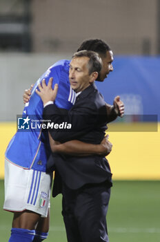 2023-10-17 - Carmine Nunziata Head Coach of  of Italy hugs Cher Ndour of Italy during Italy U21  vs Norway U21, 3° match of European Qualifiers 2025 group A, game at GNerone Claudio Druso in Bolzano - Bolzen (BZ), Italy, on October 17, 2023. - 2025 UEFA EURO UNDER 21 QUALIFIERS - ITALY VS NORWAY - UEFA EUROPEAN - SOCCER