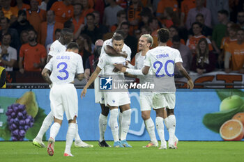 2023-10-13 - Kylian Mbappe of France celebrates his second goal with Antoine Griezmann and teammates during the UEFA Euro 2024, Qualifiers Group B football match between Netherlands and France on October 13, 2023 at Johan Cruijff ArenA in Amsterdam, Netherlands - FOOTBALL - EURO 2024 - QUALIFYING - NETHERLANDS V FRANCE - UEFA EUROPEAN - SOCCER