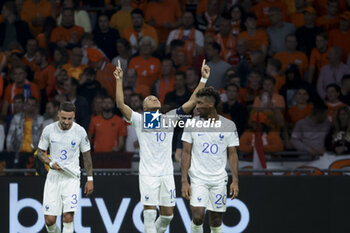 2023-10-13 - Kylian Mbappe of France celebrates his second goal with teammates during the UEFA Euro 2024, Qualifiers Group B football match between Netherlands and France on October 13, 2023 at Johan Cruijff ArenA in Amsterdam, Netherlands - FOOTBALL - EURO 2024 - QUALIFYING - NETHERLANDS V FRANCE - UEFA EUROPEAN - SOCCER