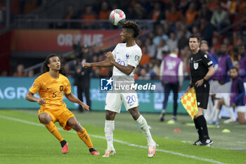 2023-10-13 - Kingsley Coman of France, left Nathan Ake of Netherlands during the UEFA Euro 2024, Qualifiers Group B football match between Netherlands and France on October 13, 2023 at Johan Cruijff ArenA in Amsterdam, Netherlands - FOOTBALL - EURO 2024 - QUALIFYING - NETHERLANDS V FRANCE - UEFA EUROPEAN - SOCCER