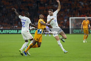 2023-10-13 - Denzel Dumfries of Netherlands between Rando Kolo Muani and Adrien Rabiot of France during the UEFA Euro 2024, Qualifiers Group B football match between Netherlands and France on October 13, 2023 at Johan Cruijff ArenA in Amsterdam, Netherlands - FOOTBALL - EURO 2024 - QUALIFYING - NETHERLANDS V FRANCE - UEFA EUROPEAN - SOCCER
