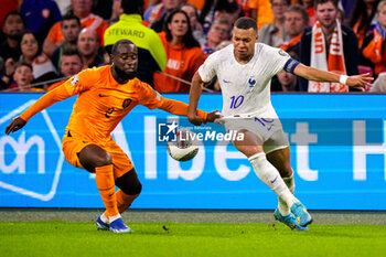 2023-10-13 - Lutsharel Geertruida of the Netherlands, Kylian Mbappe of France during the UEFA Euro 2024, Qualifiers Group B football match between Netherlands and France on October 13, 2023 at Johan Cruijff ArenA in Amsterdam, Netherlands - FOOTBALL - EURO 2024 - QUALIFYING - NETHERLANDS V FRANCE - UEFA EUROPEAN - SOCCER