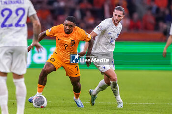 2023-10-13 - Steven Bergwijn of the Netherlands is challenged by Adrien Rabiot of France during the UEFA Euro 2024, Qualifiers Group B football match between Netherlands and France on October 13, 2023 at Johan Cruijff ArenA in Amsterdam, Netherlands - FOOTBALL - EURO 2024 - QUALIFYING - NETHERLANDS V FRANCE - UEFA EUROPEAN - SOCCER