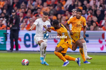 2023-10-13 - Kylian Mbappe of France is challenged by Lutsharel Geertruida of the Netherlands during the UEFA Euro 2024, Qualifiers Group B football match between Netherlands and France on October 13, 2023 at Johan Cruijff ArenA in Amsterdam, Netherlands - FOOTBALL - EURO 2024 - QUALIFYING - NETHERLANDS V FRANCE - UEFA EUROPEAN - SOCCER