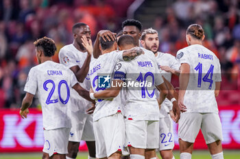 2023-10-13 - Kylian Mbappe of France celebrates after scoring her sides first goal wit his teammates during the UEFA Euro 2024, Qualifiers Group B football match between Netherlands and France on October 13, 2023 at Johan Cruijff ArenA in Amsterdam, Netherlands - FOOTBALL - EURO 2024 - QUALIFYING - NETHERLANDS V FRANCE - UEFA EUROPEAN - SOCCER