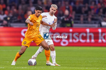 2023-10-13 - Tijjani Reijnders of the Netherlands is challenged by Antoine Griezmann of France during the UEFA Euro 2024, Qualifiers Group B football match between Netherlands and France on October 13, 2023 at Johan Cruijff ArenA in Amsterdam, Netherlands - FOOTBALL - EURO 2024 - QUALIFYING - NETHERLANDS V FRANCE - UEFA EUROPEAN - SOCCER