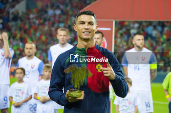2023-10-13 - Cristiano Ronaldo received the award for having played 200 matches for Portugal National Team during the UEFA Euro 2024, European Qualifiers, Group J, football match between Portugal and Slovakia on October 13, 2023 at Estadio do Dragao in Porto, Portugal - FOOTBALL - EURO 2024 - QUALIFYING - PORTUGAL V SLOVAKIA - UEFA EUROPEAN - SOCCER