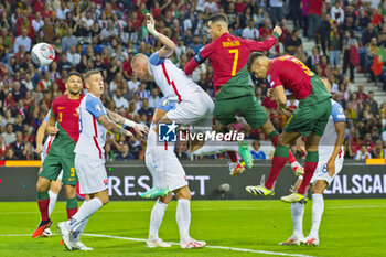 2023-10-13 - Cristiano Ronaldo of Portugal and Denis Vavro of Slovakia disputing the ball during the UEFA Euro 2024, European Qualifiers, Group J, football match between Portugal and Slovakia on October 13, 2023 at Estadio do Dragao in Porto, Portugal - FOOTBALL - EURO 2024 - QUALIFYING - PORTUGAL V SLOVAKIA - UEFA EUROPEAN - SOCCER