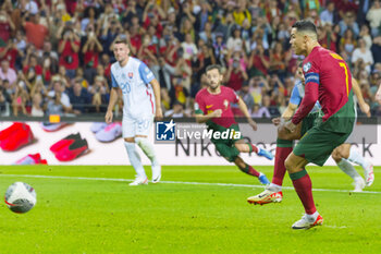 2023-10-13 - Cristiano Ronaldo of Portugal scores a penalty during the UEFA Euro 2024, European Qualifiers, Group J, football match between Portugal and Slovakia on October 13, 2023 at Estadio do Dragao in Porto, Portugal - FOOTBALL - EURO 2024 - QUALIFYING - PORTUGAL V SLOVAKIA - UEFA EUROPEAN - SOCCER