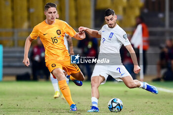 2023-10-16 - Joey Veerman of the Netherlands battles for possession with Giorgos Masouras of Greece during the UEFA Euro 2024, Qualifiers Group B football match between Greece and Netherlands on October 16, 2023 at OPAP Arena in Athens, Greece - FOOTBALL - EURO 2024 - QUALIFYING - GREECE V NETHERLANDS - UEFA EUROPEAN - SOCCER