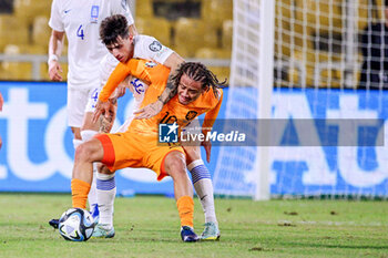2023-10-16 - Xavi Simons of the Netherlands and Lazaros Rota of Greece during the UEFA Euro 2024, Qualifiers Group B football match between Greece and Netherlands on October 16, 2023 at OPAP Arena in Athens, Greece - FOOTBALL - EURO 2024 - QUALIFYING - GREECE V NETHERLANDS - UEFA EUROPEAN - SOCCER