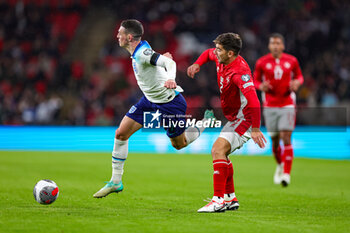 2023-11-17 - Phil Foden (7) of England battles with Cain Attard (2) of Malta during the UEFA Euro 2024, qualifiers Group C football match between England and Malta on 17 November 2023 at Wembley Stadium in London, England - FOOTBALL - EURO 2024 - QUALIFYING - ENGLAND V MALTA - UEFA EUROPEAN - SOCCER