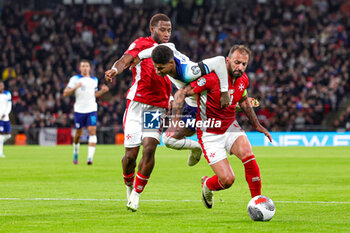 2023-11-17 - Marcus Rashford (11) of England in duel with Joseph Mbong, Steve Borg (4) of Malta during the UEFA Euro 2024, qualifiers Group C football match between England and Malta on 17 November 2023 at Wembley Stadium in London, England - FOOTBALL - EURO 2024 - QUALIFYING - ENGLAND V MALTA - UEFA EUROPEAN - SOCCER