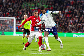 2023-11-17 - Marcus Rashford (11) of England tussles with Yannick Yankam (20) of Malta during the UEFA Euro 2024, qualifiers Group C football match between England and Malta on 17 November 2023 at Wembley Stadium in London, England - FOOTBALL - EURO 2024 - QUALIFYING - ENGLAND V MALTA - UEFA EUROPEAN - SOCCER