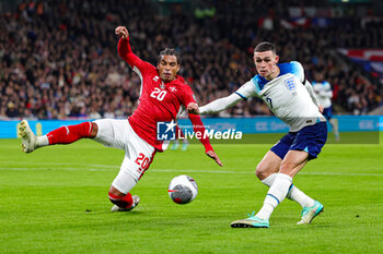 2023-11-17 - Phil Foden (7) of England and Yannick Yankam of Malta during the UEFA Euro 2024, qualifiers Group C football match between England and Malta on 17 November 2023 at Wembley Stadium in London, England - FOOTBALL - EURO 2024 - QUALIFYING - ENGLAND V MALTA - UEFA EUROPEAN - SOCCER