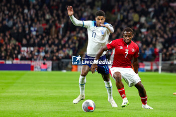 2023-11-17 - Marcus Rashford (11) of England tussles with Joseph Mbong (7) of Malta during the UEFA Euro 2024, qualifiers Group C football match between England and Malta on 17 November 2023 at Wembley Stadium in London, England - FOOTBALL - EURO 2024 - QUALIFYING - ENGLAND V MALTA - UEFA EUROPEAN - SOCCER