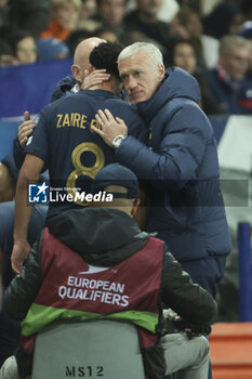 2023-11-18 - Injured, Warren Zaire-Emery of France is consoled by coach of France Didier Deschamps during the UEFA Euro 2024, Qualifiers, Group B football match between France and Gibraltar on November 18, 2023 at Allianz Riviera stadium in Nice, France - FOOTBALL - EURO 2024 - QUALIFYING - FRANCE V GIBRALTAR - UEFA EUROPEAN - SOCCER