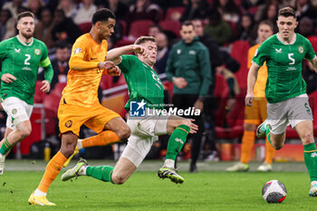2023-11-18 - Cody Gakpo of The Netherlands and Nathan Collins of Ireland during the UEFA EURO 2024, Qualifiers Group B football match between Netherlands and Republic of Ireland on November 18, 2023 at Johan Cruijff ArenA in Amsterdam, Netherlands - FOOTBALL - EURO 2024 - QUALIFYING - NETHERLANDS V REPUBLIC OF IRELAND - UEFA EUROPEAN - SOCCER