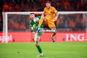 2023-11-18 - Nathan Collins of Ireland, Wout Weghorst of The Netherlands during the UEFA EURO 2024, Qualifiers Group B football match between Netherlands and Republic of Ireland on November 18, 2023 at Johan Cruijff ArenA in Amsterdam, Netherlands - FOOTBALL - EURO 2024 - QUALIFYING - NETHERLANDS V REPUBLIC OF IRELAND - UEFA EUROPEAN - SOCCER