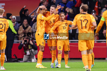 2023-11-18 - Wout Weghorst of The Netherlands celebrates his goal 1-0 with Cody Gakpo, Xavi Simons during the UEFA EURO 2024, Qualifiers Group B football match between Netherlands and Republic of Ireland on November 18, 2023 at Johan Cruijff ArenA in Amsterdam, Netherlands - FOOTBALL - EURO 2024 - QUALIFYING - NETHERLANDS V REPUBLIC OF IRELAND - UEFA EUROPEAN - SOCCER
