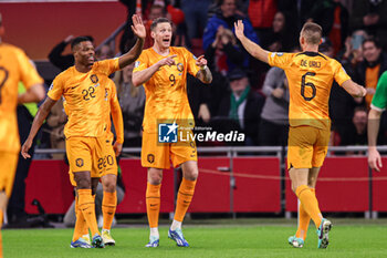 2023-11-18 - Wout Weghorst of The Netherlands celebrates his goal 1-0 with Denzel Dumfries, Stefan de Vrij during the UEFA EURO 2024, Qualifiers Group B football match between Netherlands and Republic of Ireland on November 18, 2023 at Johan Cruijff ArenA in Amsterdam, Netherlands - FOOTBALL - EURO 2024 - QUALIFYING - NETHERLANDS V REPUBLIC OF IRELAND - UEFA EUROPEAN - SOCCER