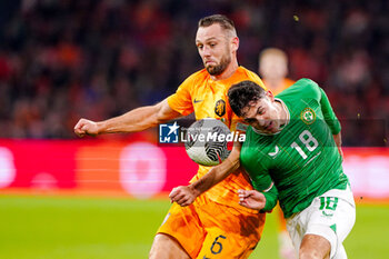 2023-11-18 - Stefan de Vrij and Jamie McGrath of Ireland during the UEFA EURO 2024, Qualifiers Group B football match between Netherlands and Republic of Ireland on November 18, 2023 at Johan Cruijff ArenA in Amsterdam, Netherlands - FOOTBALL - EURO 2024 - QUALIFYING - NETHERLANDS V REPUBLIC OF IRELAND - UEFA EUROPEAN - SOCCER