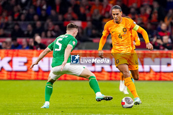 2023-11-18 - Dara O'Shea of Ireland and Virgil van Dijk of The Netherlands during the UEFA EURO 2024, Qualifiers Group B football match between Netherlands and Republic of Ireland on November 18, 2023 at Johan Cruijff ArenA in Amsterdam, Netherlands - FOOTBALL - EURO 2024 - QUALIFYING - NETHERLANDS V REPUBLIC OF IRELAND - UEFA EUROPEAN - SOCCER