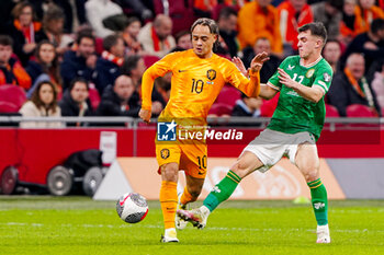 2023-11-18 - Xavi Simons of The Netherlands and James McClean of Ireland during the UEFA EURO 2024, Qualifiers Group B football match between Netherlands and Republic of Ireland on November 18, 2023 at Johan Cruijff ArenA in Amsterdam, Netherlands - FOOTBALL - EURO 2024 - QUALIFYING - NETHERLANDS V REPUBLIC OF IRELAND - UEFA EUROPEAN - SOCCER