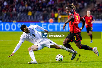 2023-11-19 - Emin Makhmudov of Azerbaijan battles for possession with Jeremy Doku of Belgium during the UEFA Euro 2024, Qualifiers Group F football match between Belgium and Azerbaijan on November 19, 2023 at King Baudouin Stadium in Brussels, Belgium - FOOTBALL - EURO 2024 - QUALIFYING - BELGIUM V AZERBAIJAN - UEFA EUROPEAN - SOCCER