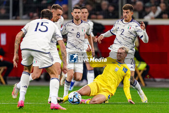 2023-11-20 - Mykhailo Mudryk of Ukraine falling after battling for possession with Giovanni Di Lorenzo of Italy during the UEFA Euro 2024, Qualifiers Group C football match between Ukraine and Italy on November 20, 2023 at BayArena in Leverkusen, Germany - FOOTBALL - EURO 2024 - QUALIFYING - UKRAINE V ITALY - UEFA EUROPEAN - SOCCER