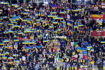 2023-11-20 - Fans and Supporters of Ukraine holding up flags and cheering during the UEFA Euro 2024, Qualifiers Group C football match between Ukraine and Italy on November 20, 2023 at BayArena in Leverkusen, Germany - FOOTBALL - EURO 2024 - QUALIFYING - UKRAINE V ITALY - UEFA EUROPEAN - SOCCER