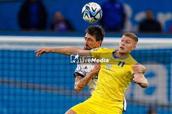 2023-11-20 - Francesco Acerbi of Italy battles with Artem Dovbyk of Ukraine during the UEFA Euro 2024, Qualifiers Group C football match between Ukraine and Italy on November 20, 2023 at BayArena in Leverkusen, Germany - FOOTBALL - EURO 2024 - QUALIFYING - UKRAINE V ITALY - UEFA EUROPEAN - SOCCER