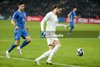 2023-11-21 - Adrien Rabiot of France, left Tasos Bakasetas of Greece during the UEFA Euro 2024, Qualifiers, Group B football match between Greece and France on November 21, 2023 at OPAP Arena in Athens, Greece - FOOTBALL - EURO 2024 - QUALIFYING - GREECE V FRANCE - UEFA EUROPEAN - SOCCER