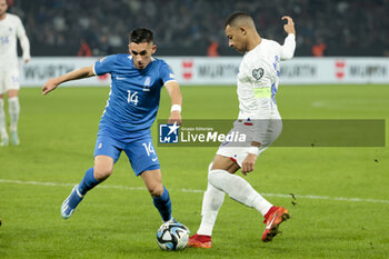 2023-11-21 - Kylian Mbappe of France, left Sotiris Alexandropoulos of Greece during the UEFA Euro 2024, Qualifiers, Group B football match between Greece and France on November 21, 2023 at OPAP Arena in Athens, Greece - FOOTBALL - EURO 2024 - QUALIFYING - GREECE V FRANCE - UEFA EUROPEAN - SOCCER