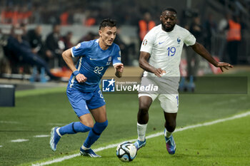 2023-11-21 - Dimitris Giannoulis of Greece, Youssouf Fofana of France during the UEFA Euro 2024, Qualifiers, Group B football match between Greece and France on November 21, 2023 at OPAP Arena in Athens, Greece - FOOTBALL - EURO 2024 - QUALIFYING - GREECE V FRANCE - UEFA EUROPEAN - SOCCER