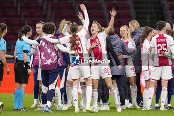 2023-12-20 - Lotte Keukelaar and Isa Kardinaal of AFC Ajax celebrating the win with teammates during the UEFA Women's Champions League, Group C football match between AFC Ajax and Bayern Munich on December 20, 2023 at Johan Cruijff ArenA in Amsterdam, Netherlands - FOOTBALL - WOMEN'S CHAMPIONS LEAGUE - AJAX V BAYERN MUNICH - UEFA CHAMPIONS LEAGUE WOMEN - SOCCER